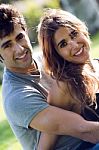 Outdoor Portrait Of Young Caucasian Couple At The Park Stock Photo
