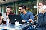 Outdoor Portrait Of Young Entrepreneurs Working At Coffee Bar Stock Photo