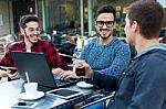 Outdoor Portrait Of Young Entrepreneurs Working At Coffee Bar Stock Photo