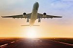 Passenger Plane Taking Over Airport Runway Use For Air Transport And Traveling Theme Stock Photo