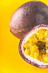 Passion Fruit On The Yellow Background Vertical Stock Photo