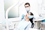 Patient Getting Treated By Orthodontist Stock Photo