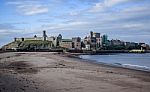 Peel Castle As Seen From The Beach At The Entrance To Peel Harbour, St Patrick's Isle, Peel, Isle Of Man Stock Photo