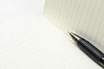 Pen And Blank Opened Notebook Stock Photo