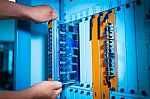 People Fix Core Switch In Network Room Stock Photo