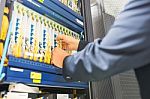 People Fix Node Fiber Optic In Network Room Stock Photo