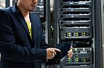 People Fix Server Network In Data Room Stock Photo