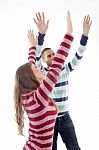 People With Raised Arms And Looking Upward Stock Photo