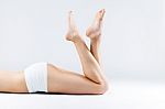Perfect Smooth And Waxed Woman Legs With Feet Pointing Up Stock Photo