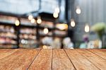 Perspective Wood And Blurred Cafe Background Stock Photo