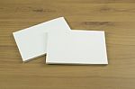 Photo Of Blank Business Cards With Soft Shadows On Light Wooden Stock Photo