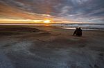 Photographer Taking A Sun Set Photograph On Hokitika Beach South Island New Zealand Stock Photo
