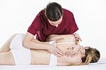 Physical Therapist Which Makes Scapular Mobilization To A Woman Stock Photo