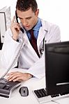 Physician Talking Over Phone Stock Photo
