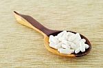 Pills On Wooden Spoon Stock Photo