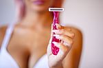 Pink Hair Attractive Woman Hold Pink Female Shaver In Hand Stock Photo
