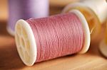 Pink Thread On Wood Table Shallow Depth Of Field (soft Focus) Stock Photo