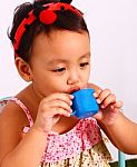 Play Acting With Toy Cup Stock Photo