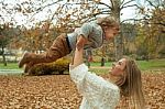 Playful Mother And Son In Park Stock Photo