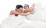 Playful Young Beautiful Couple With Pillows Stock Photo
