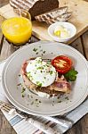 Poached Egg And Bacon On Rye Bread, Healthy Breakfast Stock Photo