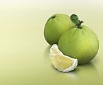 Pomelo On Green Solid Background Stock Photo