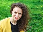 Portrait Of A Beautiful Young Woman In The Park Stock Photo