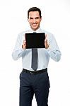 Portrait Of A Smiling Businessman With Digital Tablet Stock Photo