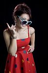 Portrait Of A Women In Retro Red Dress With Sunglasses Stock Photo