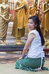 Portrait Of Asian Woman Praying Buddha Statue Stock Photo