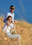 Portrait Of Asian Younger Man And Woman Relaxing Vacation At Sea Side Happiness Emotion Stock Photo