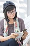 Portrait Of Beautiful Asian Woman Relaxing Time Reading Book On Cradle Happiness Emotion With Smiling Face Stock Photo