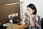 Portrait Of Beautiful Business Woman Drinking Water At Office Stock Photo