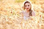 Portrait Of Beautiful Girl In Field Stock Photo