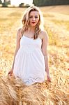 Portrait Of Beautiful Girl In Field Stock Photo