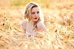 Portrait Of Beautiful Girl In Field Stock Photo