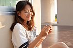 Portrait Of Beautiful Young And Teen Woman Looking To Mobile Pho Stock Photo