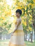 Portrait Of Couples Beautiful Asian Woman Standing In Blooming Flowers Park With Happiness Emotion Stock Photo