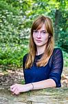 Portrait Of Dutch Redhead Teenage Girl In Forest Stock Photo
