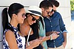 Portrait Of Group Of Friends Having Fun With Smartphones Stock Photo