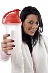 Portrait Of Smiling Woman Posing With Water Bottle Stock Photo