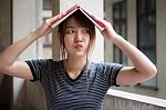 Portrait Of Thai Adult Beautiful Girl Reading Red Book Stock Photo