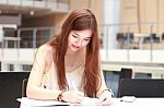 Portrait Of Thai Adult Beautiful Girl Write A Book And Smile In University Stock Photo