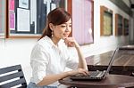 Portrait Of Thai Adult Businesswoman Beautiful Girl Using Computer Notebook Stock Photo