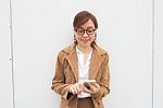 Portrait Of Thai Adult Businesswoman Beautiful Girl Using Her Smart Phone Stock Photo