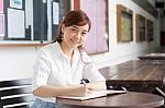 Portrait Of Thai Adult Businesswoman Beautiful Girl Write A Book Stock Photo