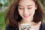 Portrait Of Thai Adult Student University Beautiful Girl Using Her Smart Phone Stock Photo