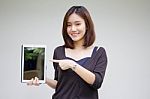 Portrait Of Thai Adult Student University Beautiful Girl Using Her Tablet Stock Photo