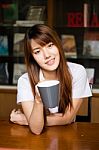 Portrait Of Thai Adult Student University Uniform Beautiful Drinking Coffee Stock Photo