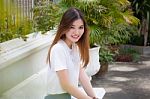 Portrait Of Thai Chinese Adult Beautiful Girl Denim Blue Bag Relax And Smile Stock Photo
